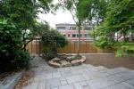 Golden Manor — private rear garden with stone paving and mature planting