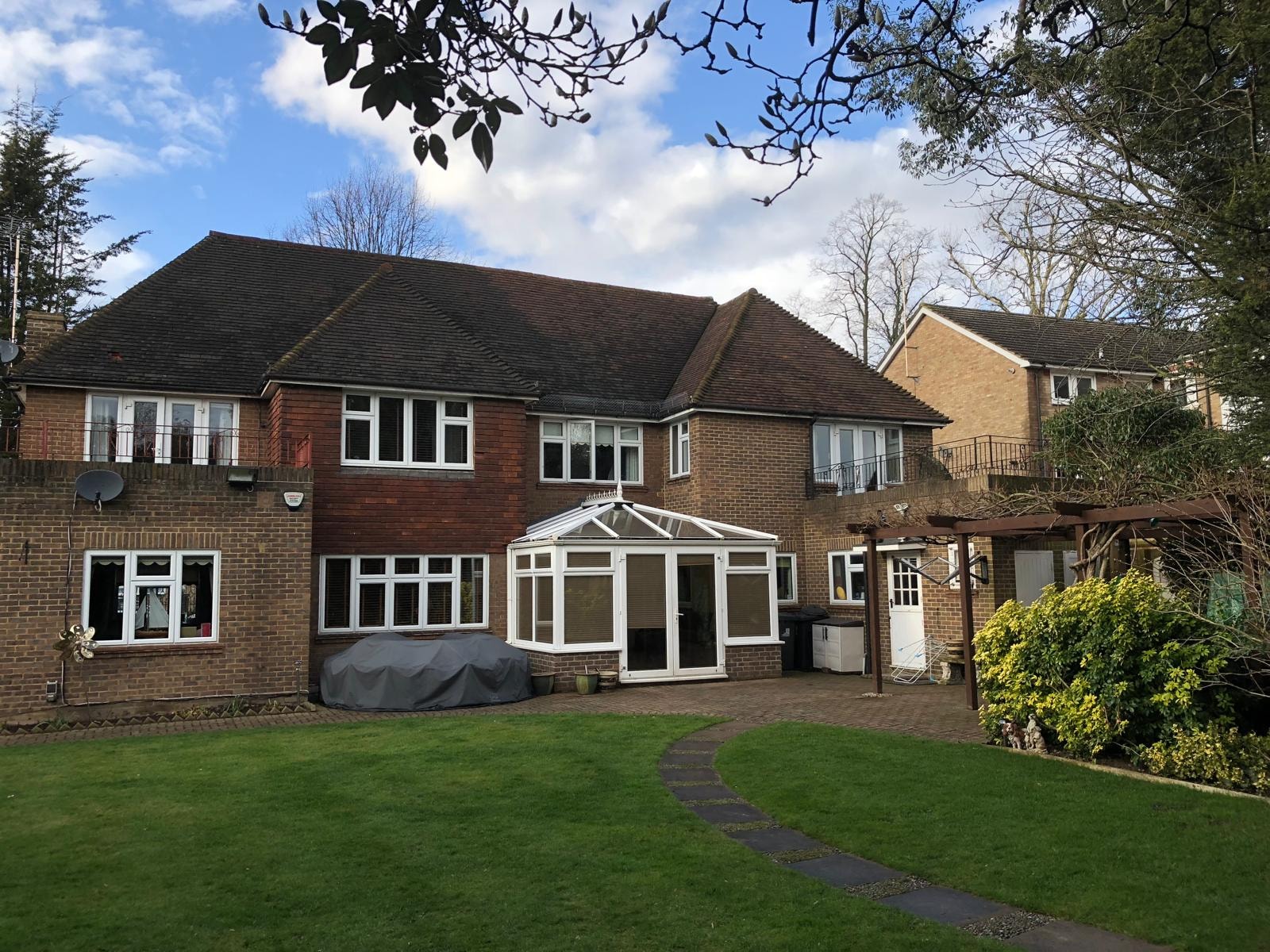 Golden Manor — rear elevation of the original house with garden and conservatory