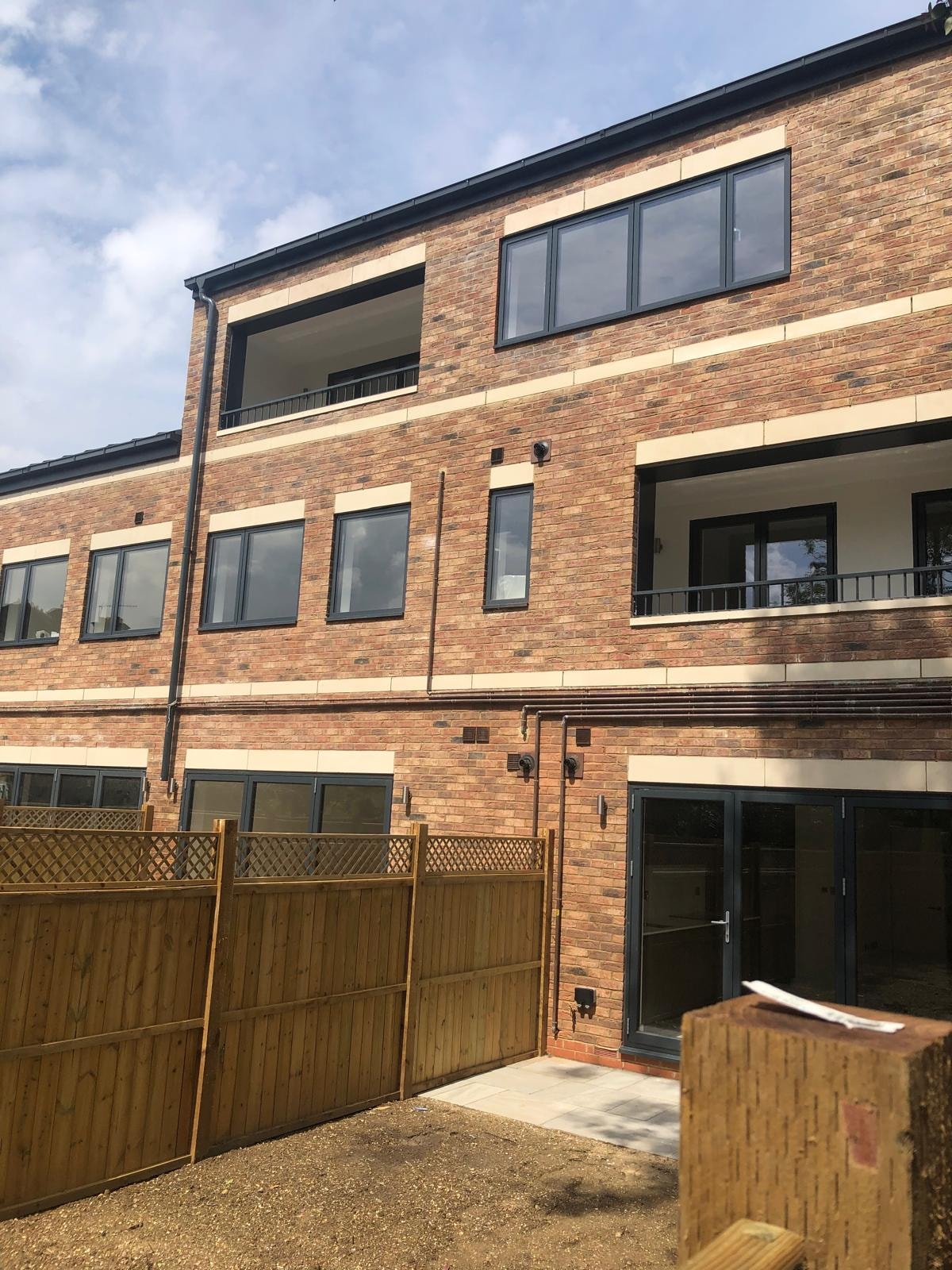 Golden Manor — completed rear elevation with balconies and large windows