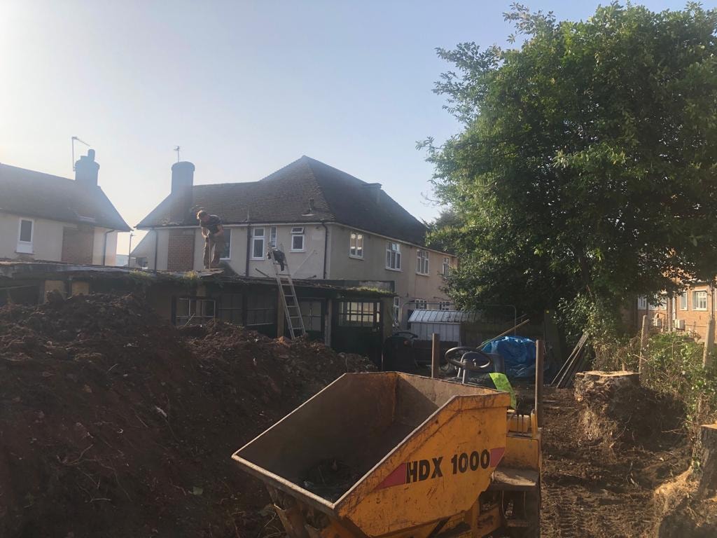Harrow Road — construction site with excavator during groundworks phase