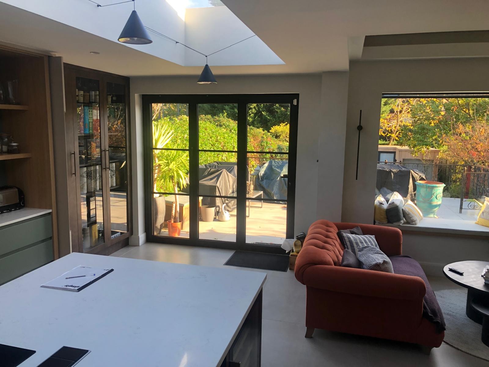 Love Lane — open plan kitchen and dining space with skylight and black framed glazing