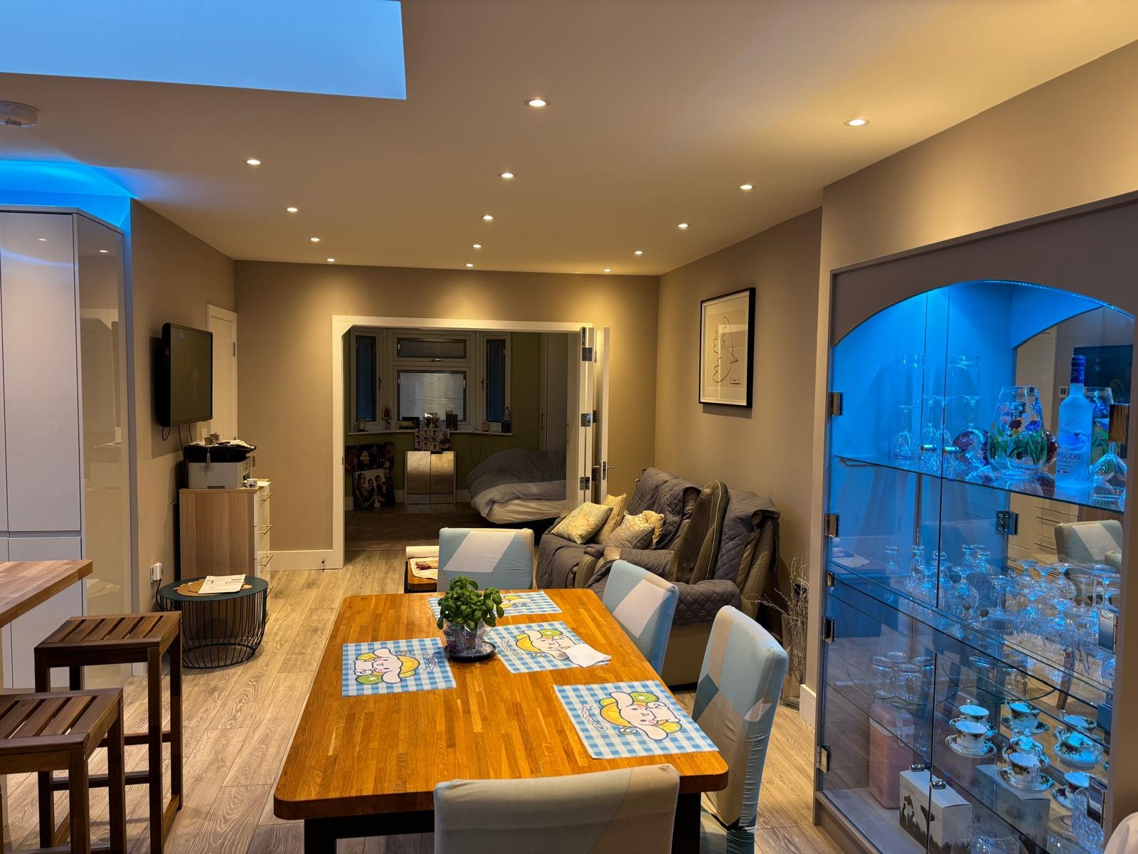 Pursley Road — completed open-plan living and dining space with display cabinet and blue LED lighting