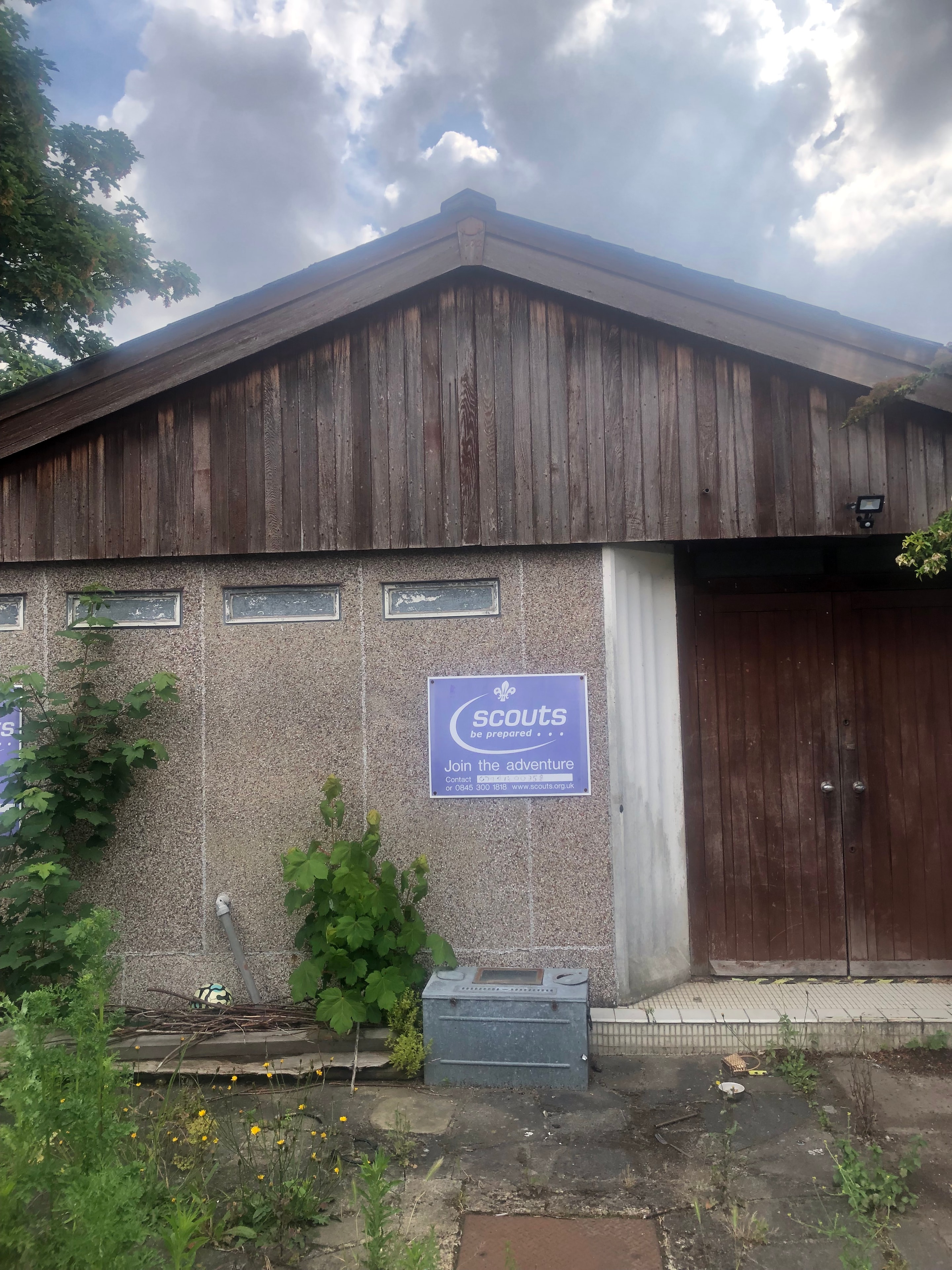 Scouts Hall — existing scouts hall building with Scouts sign on rendered facade