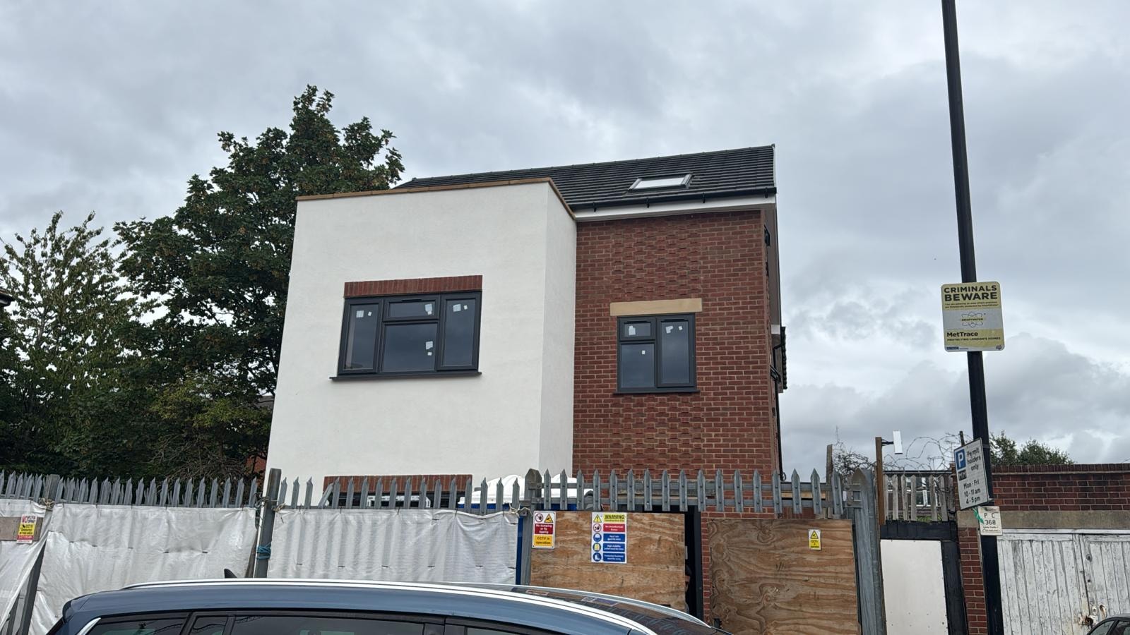 Scouts Hall — completed building front elevation under construction with hoarding