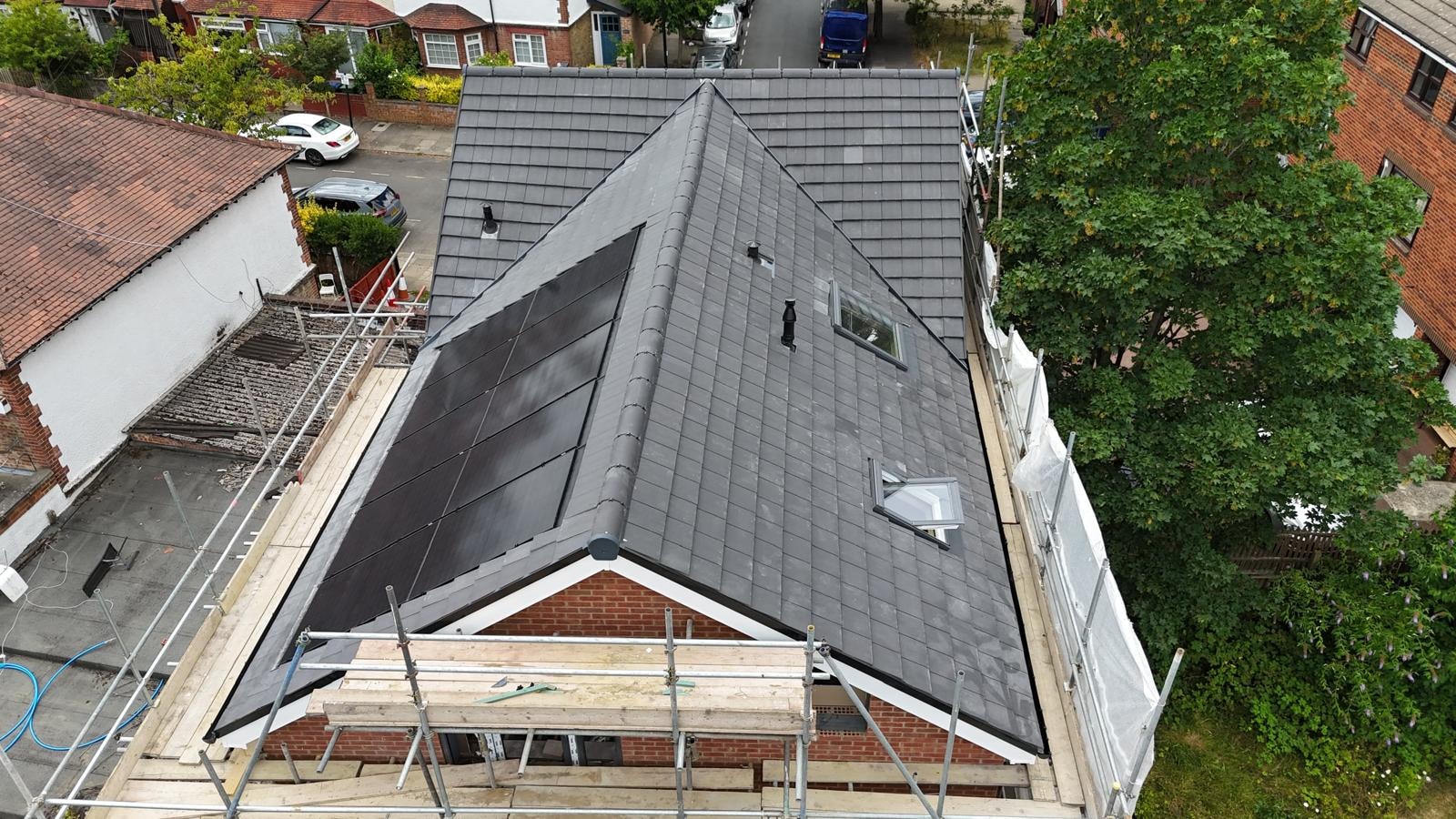 Scouts Hall — aerial view of completed roof with solar panels and scaffolding