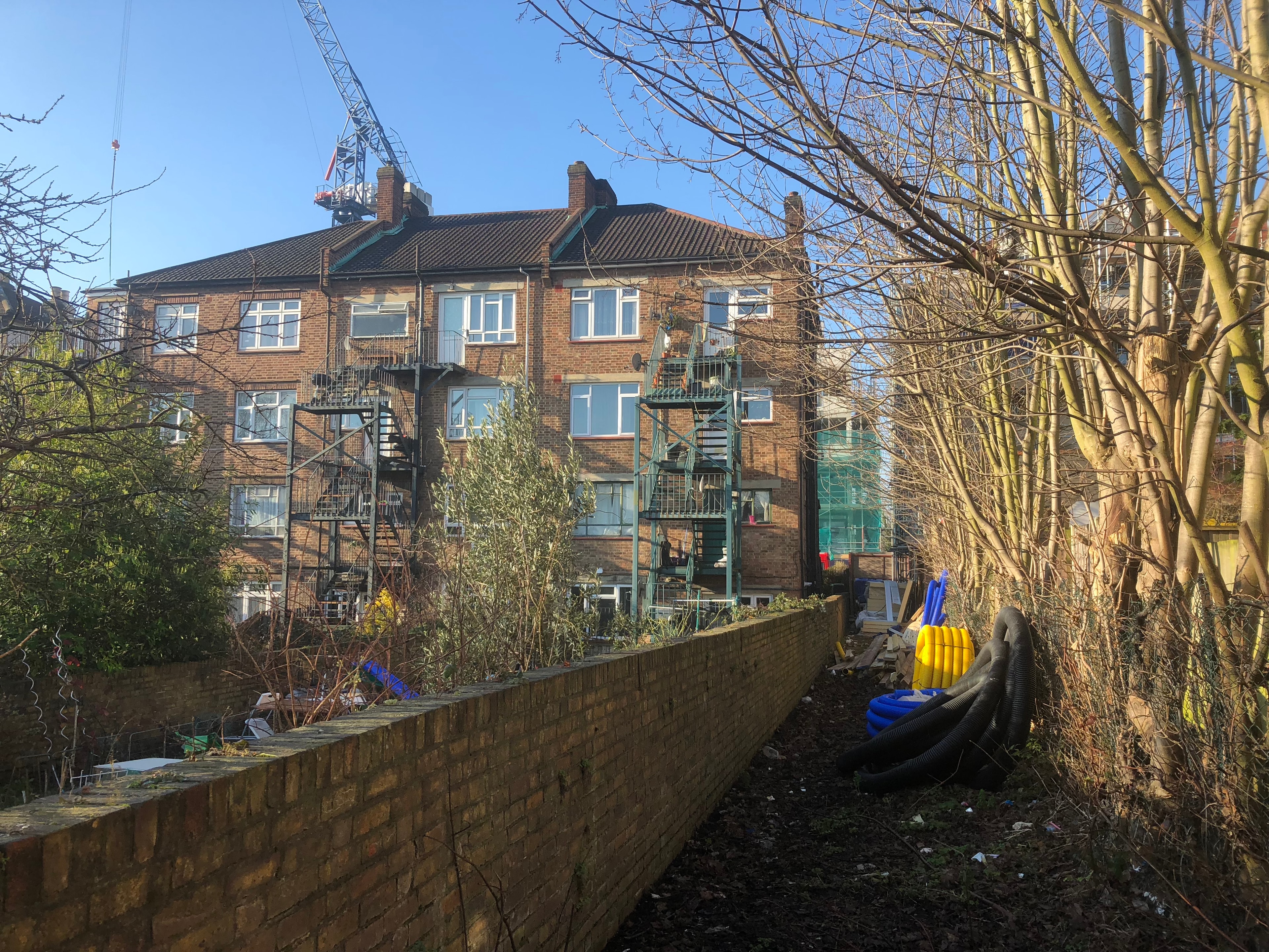 Station Road — surrounding residential context, brick building with fire escapes