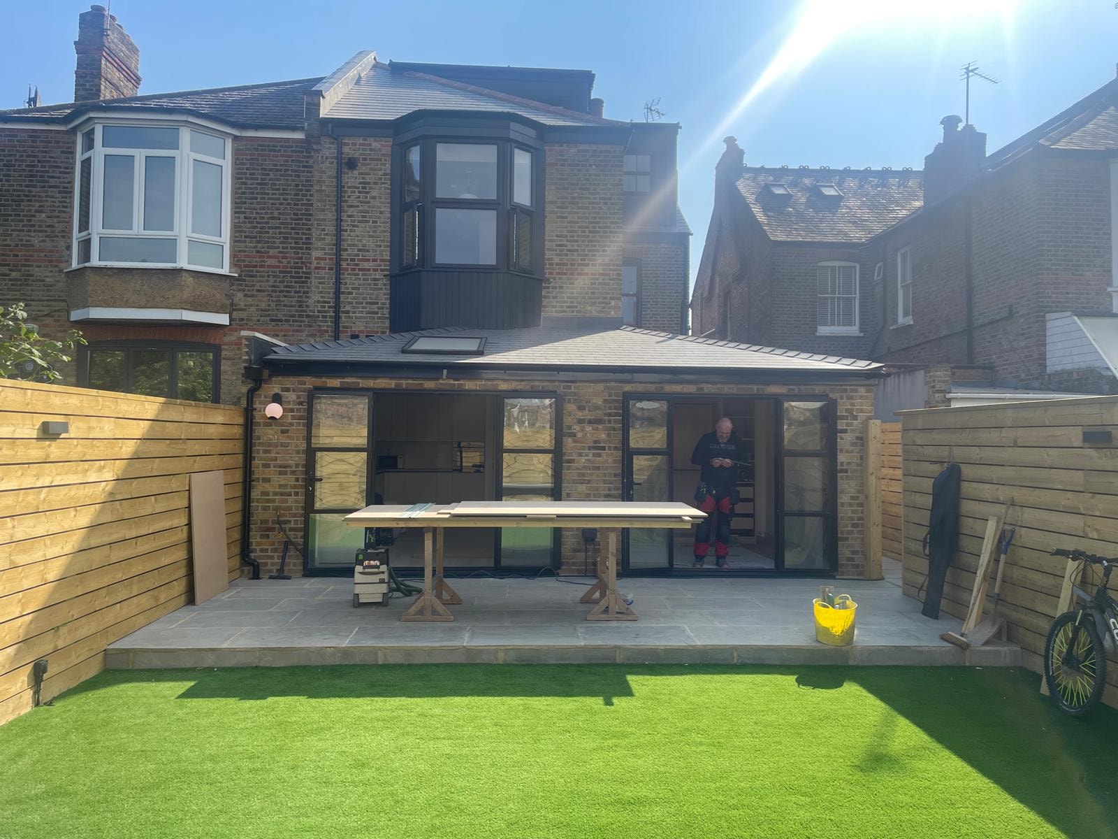 Twyford Avenue — completed brick rear extension with patio — RPR homeowner project