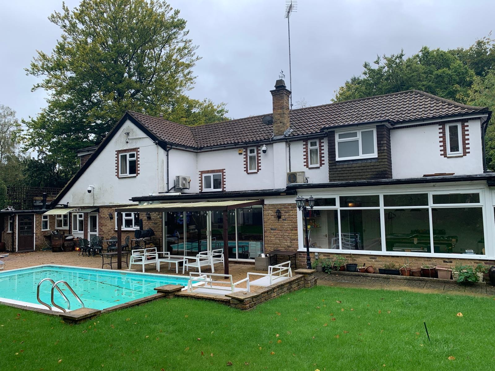 Valley Road — existing rear of house with swimming pool and conservatory before demolition