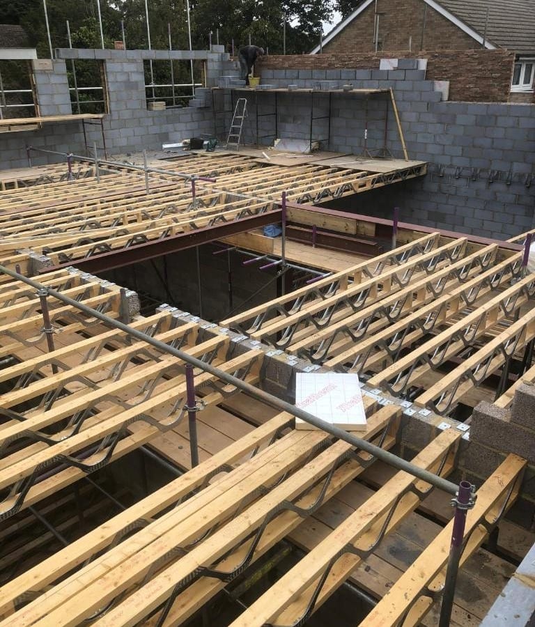 RPR project management and construction — timber floor joists and structural framing on site