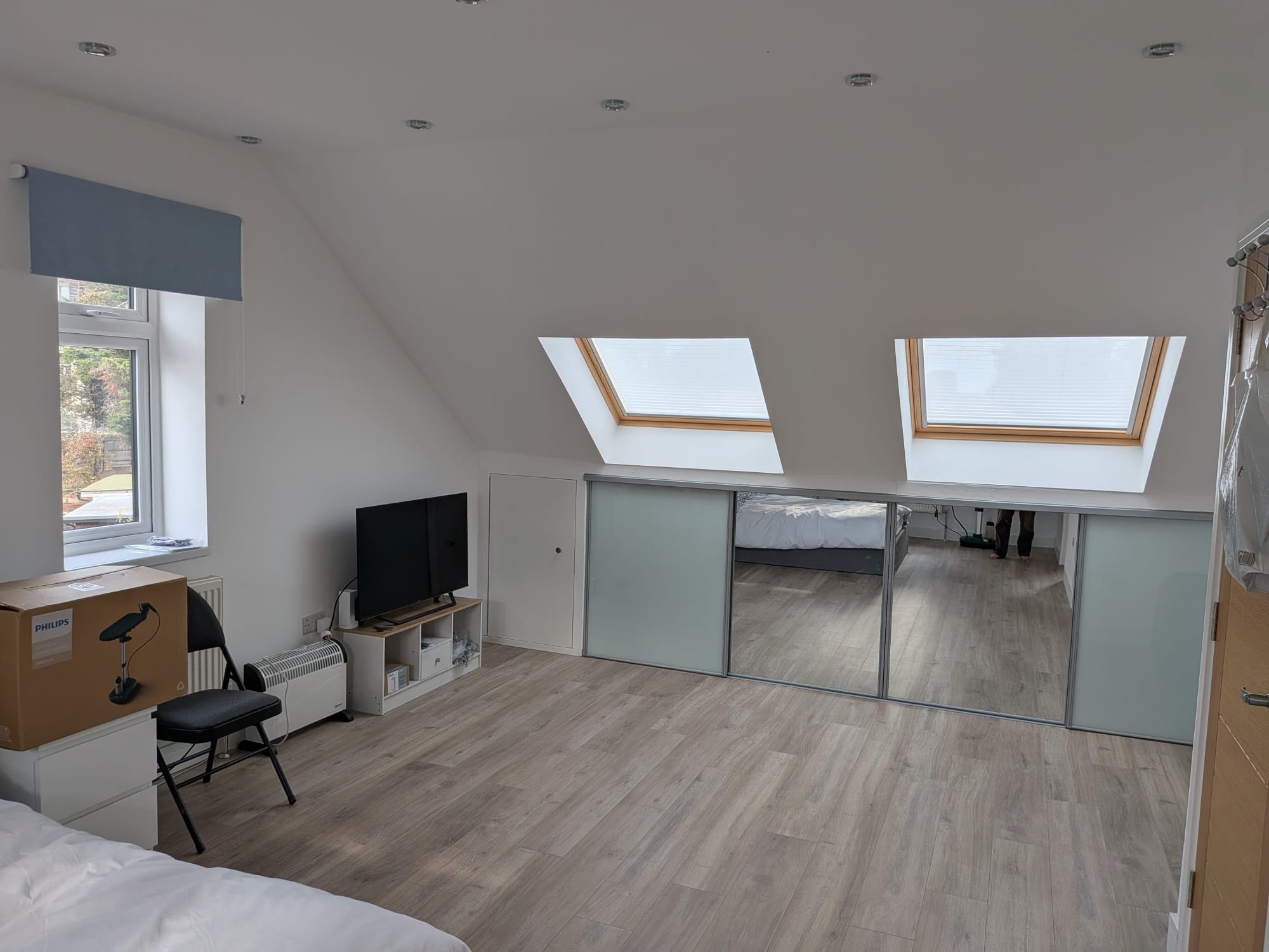 Orchard Gate — loft ensuite bedroom with Velux skylights and fitted wardrobes
