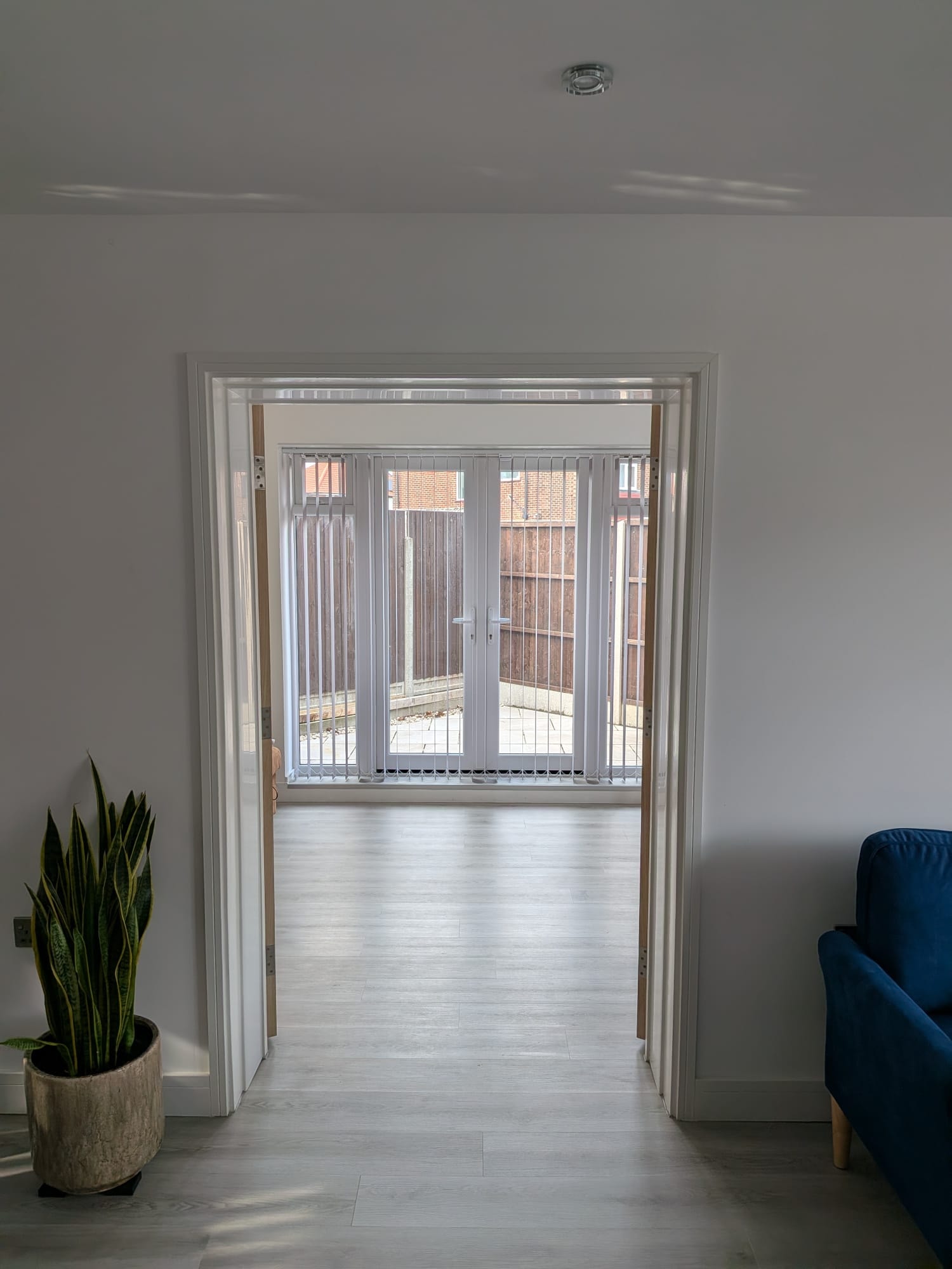 Orchard Gate — living room with patio doors to rear garden