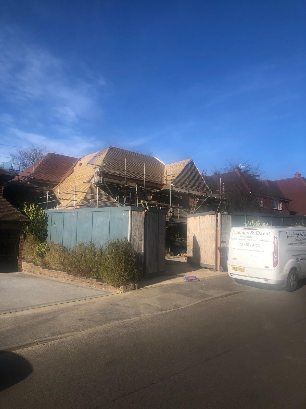 The Comyns — house under construction with scaffolding to front elevation