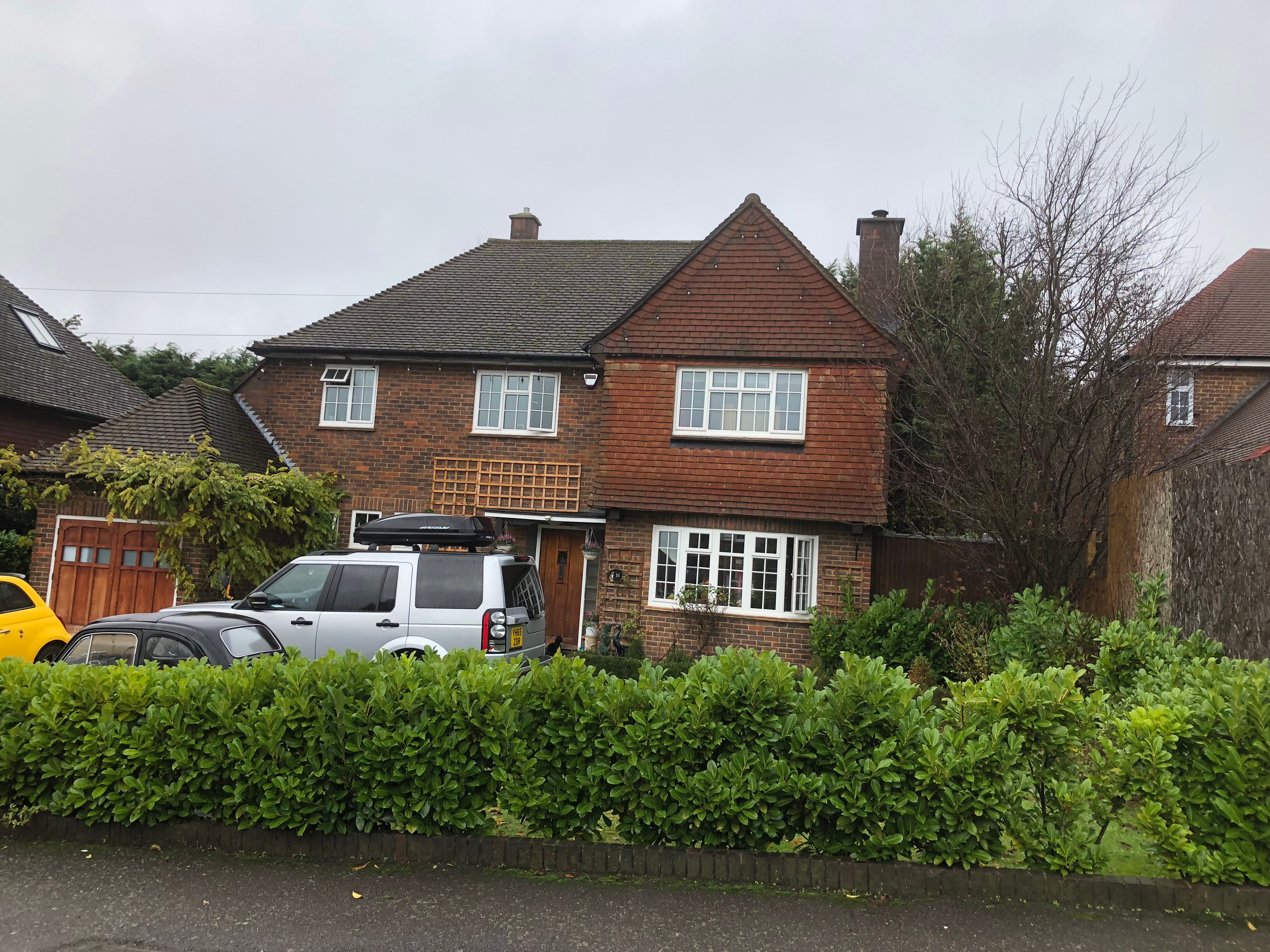 The Comyns — original front elevation from street showing existing house and driveway